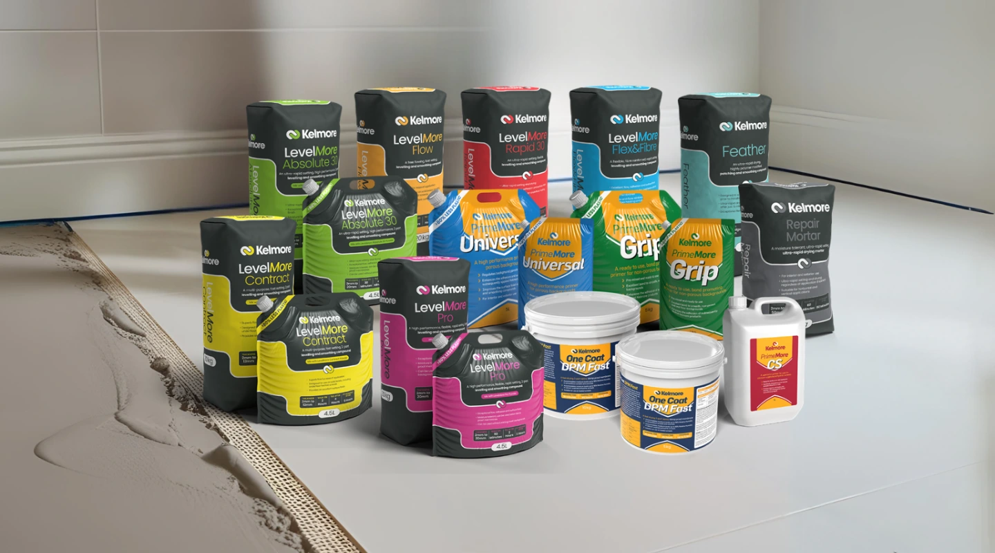 Kelmore adhesives and levelling compounds are displayed on a prepared subfloor